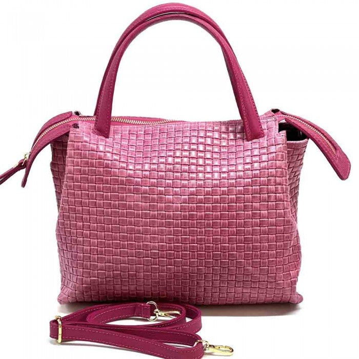 A Pink cow leather handbag with a woven pattern, featuring dual handles and a shoulder strap.