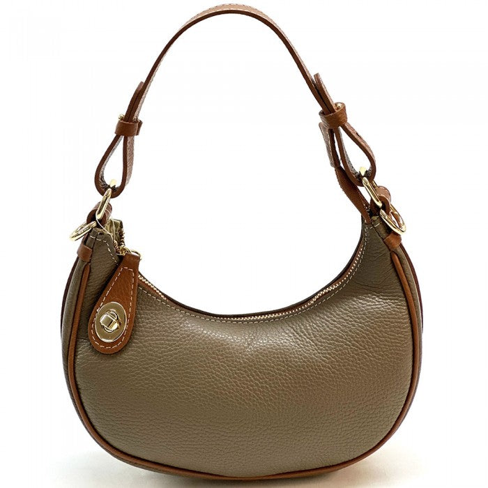 A green Noemi leather handbag with a pebble-grain texture, featuring a crescent shape, vintage brass hardware, a detachable shoulder strap, and a top handle.