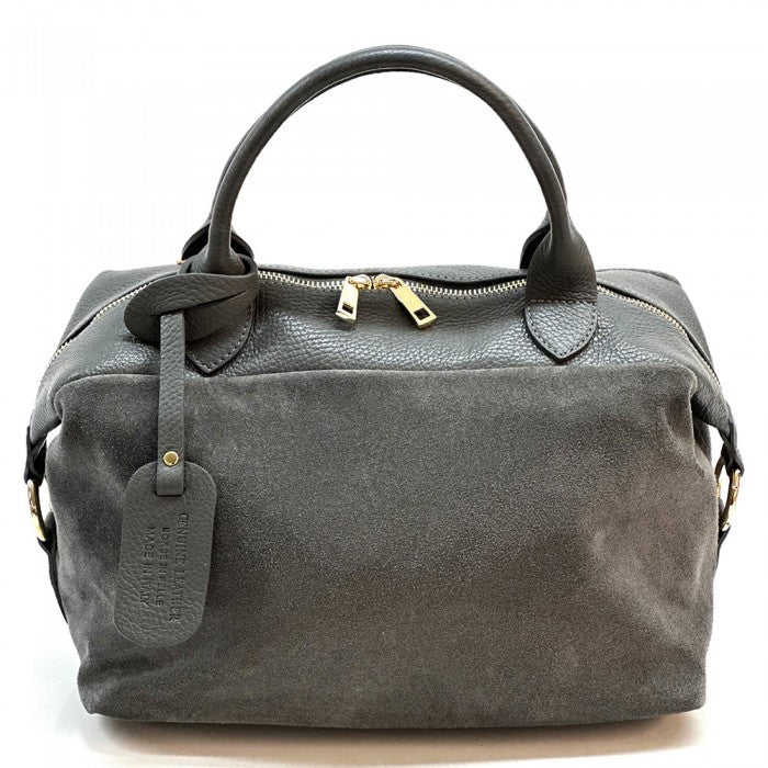 A navy blue Emma Leather Boston Bag with suede texture and black leather trimmings, featuring dual top handles and a detachable shoulder strap.