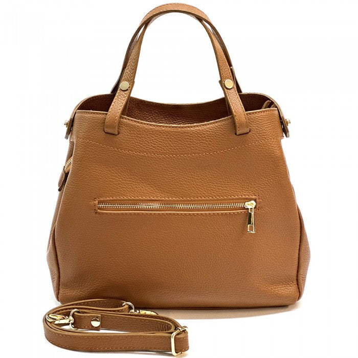 A brown Siena handbag made of premium Italian leather, featuring a structured silhouette with soft curves and gold-tone hardware, designed for both casual and formal settings.