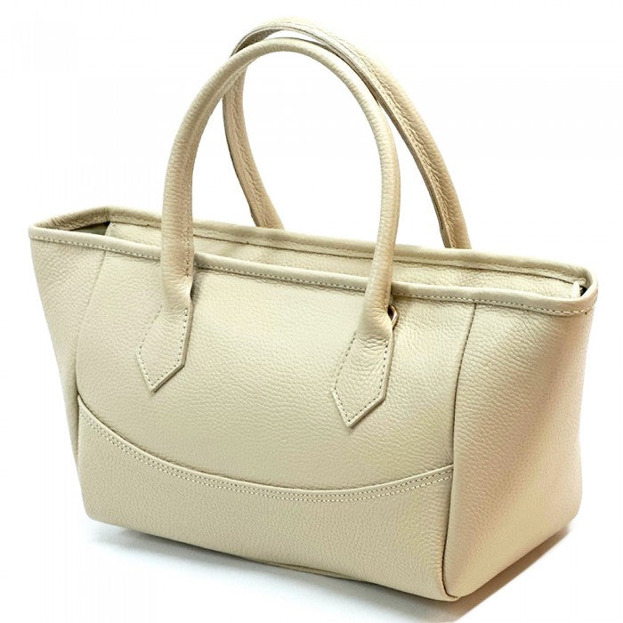 A Beig Italian leather tote bag with twin handles and a detachable leather keychain.