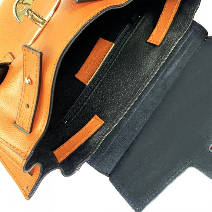 A Italian leather handbag with a structured design, double handles, and a gold-tone clasp.
