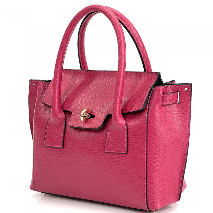 A pink Italian leather handbag with a structured design, double handles, and a gold-tone clasp.