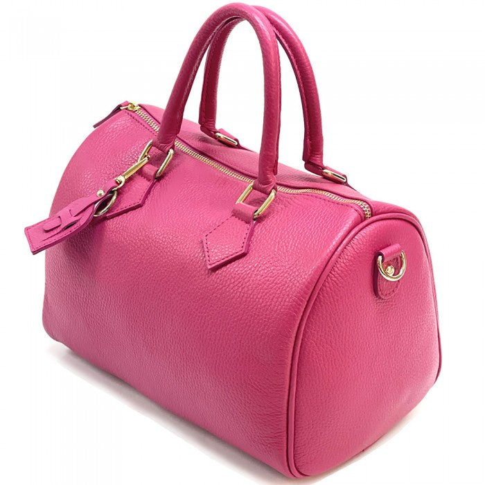 A pink Erminia GM cow leather handbag with visible texture, two handles, and metallic hardware.
