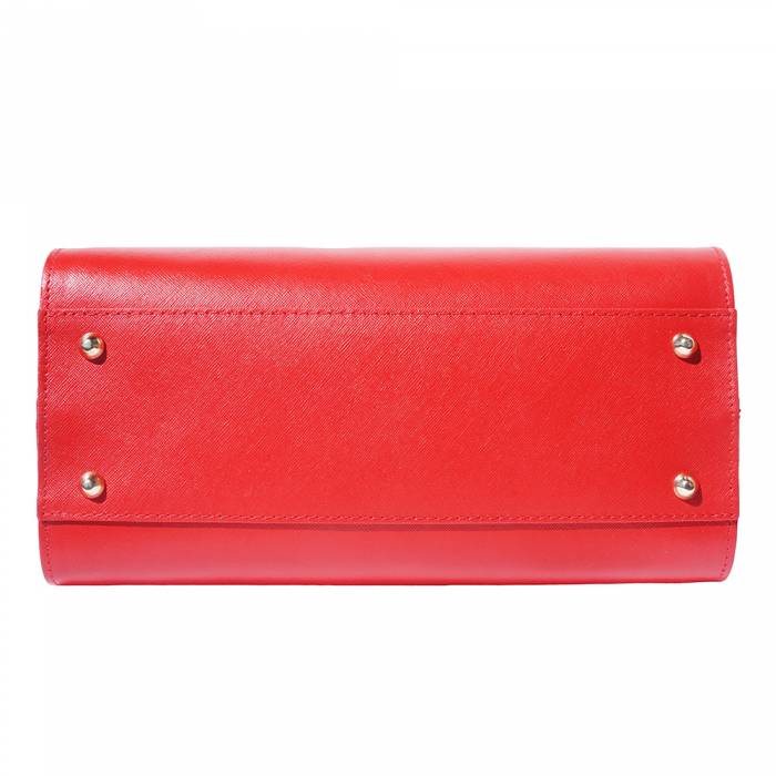 A red leather handbag with golden metal hardware and a decorative tag on one of the handles.