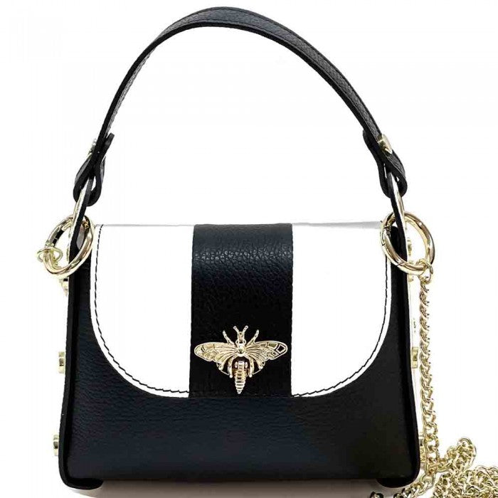 A black and white leather handbag with a gold bee metal embellishment, featuring a structured silhouette and a metal chain strap.