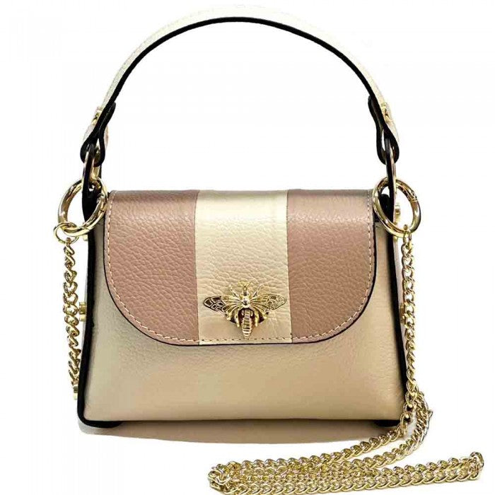 A black and white leather handbag with a gold bee metal embellishment, featuring a structured silhouette and a metal chain strap.