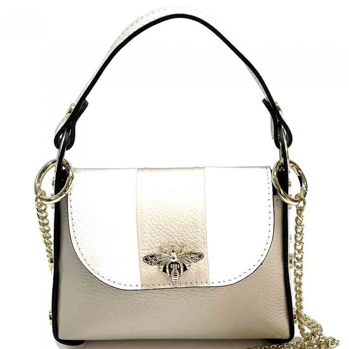 A black and white leather handbag with a gold bee metal embellishment, featuring a structured silhouette and a metal chain strap.