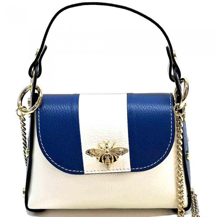 A black and white leather handbag with a gold bee metal embellishment, featuring a structured silhouette and a metal chain strap.