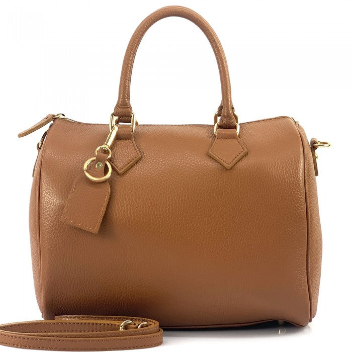 A Erminia GM cow leather handbag with visible texture, two handles, and metallic hardware.