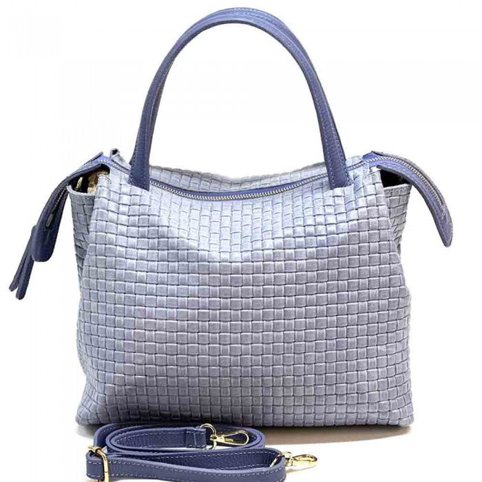 A cow leather handbag with a woven pattern, featuring dual handles and a shoulder strap.