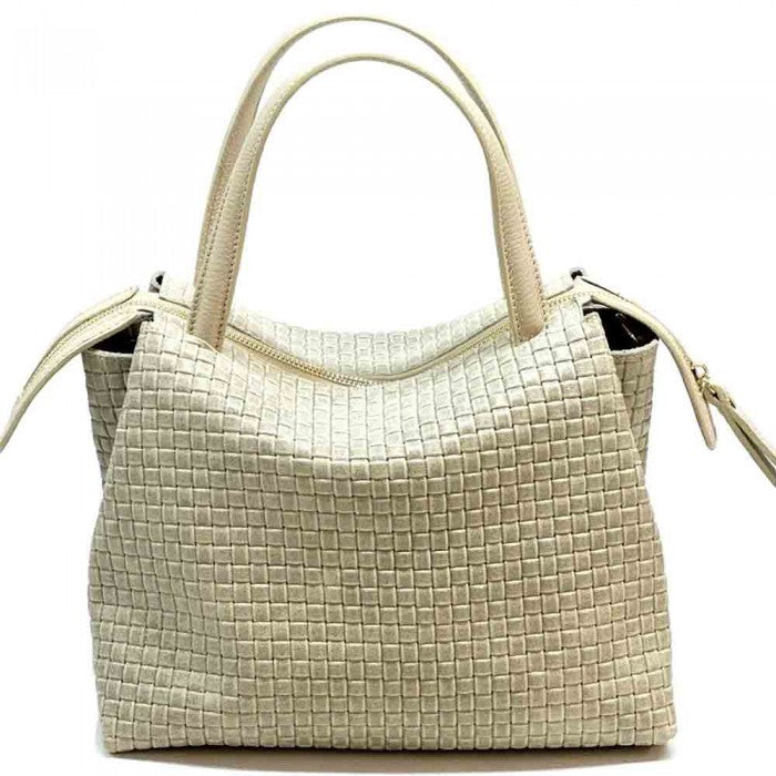 A cow leather handbag with a woven pattern, featuring dual handles and a shoulder strap.