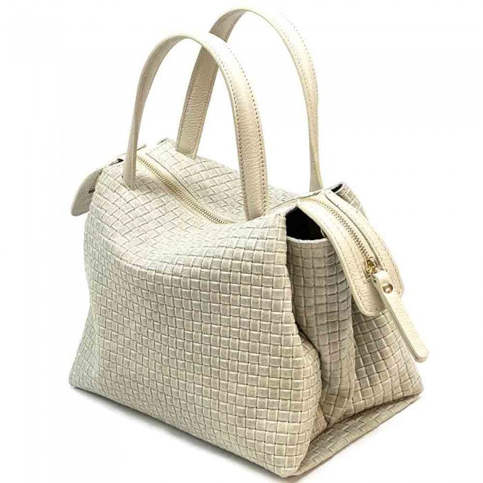 A cow leather handbag with a woven pattern, featuring dual handles and a shoulder strap.