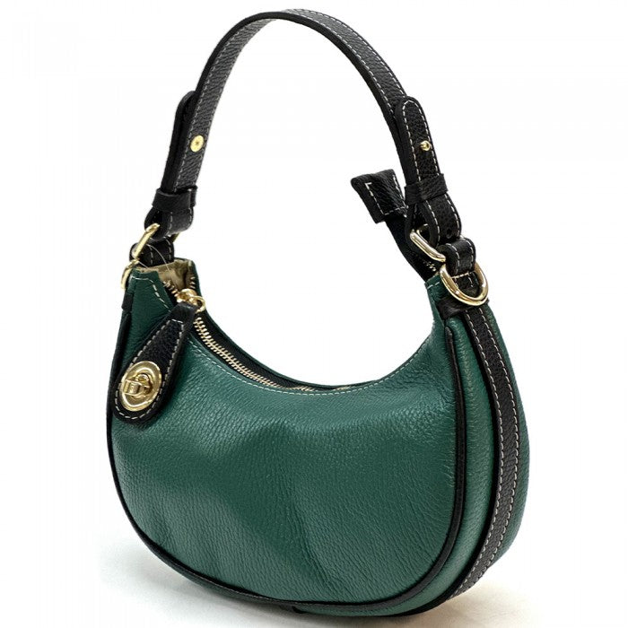 A green Noemi leather handbag with a pebble-grain texture, featuring a crescent shape, vintage brass hardware, a detachable shoulder strap, and a top handle.