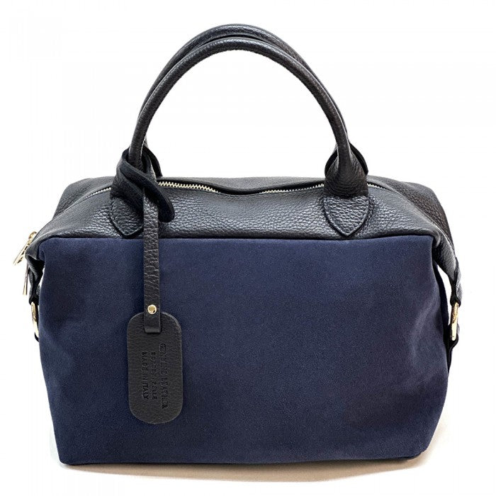 A navy blue Emma Leather Boston Bag with suede texture and black leather trimmings, featuring dual top handles and a detachable shoulder strap.
