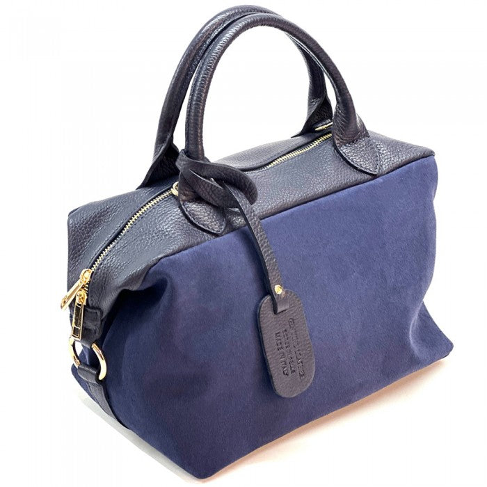 A navy blue leather Boston bag with dual top handles and a detachable shoulder strap.