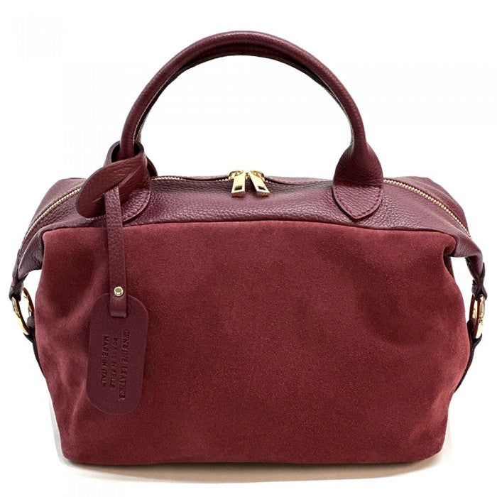 A Emma Leather Boston Bag with suede texture and black leather trimmings, featuring dual top handles and a detachable shoulder strap.
