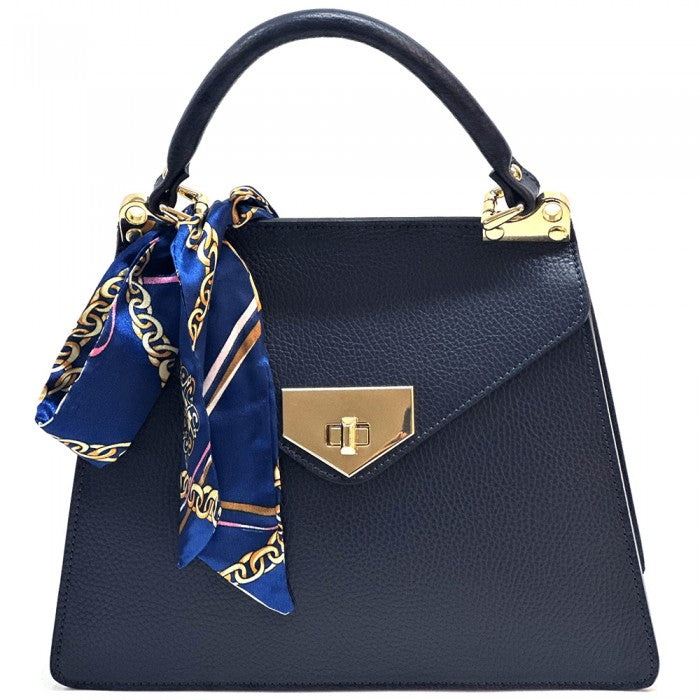 A  black leather handbag with gold-tone metal details and a decorative scarf attached to the handle.