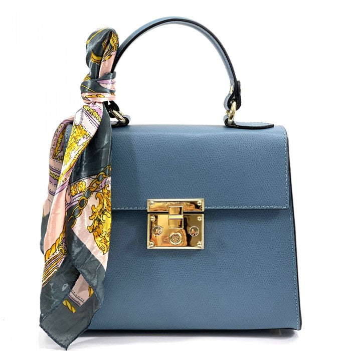 A Black Bella Mini Tote handbag with a silk scarf wrapped around the handle, featuring a gold-tone twist lock and a detachable shoulder strap.