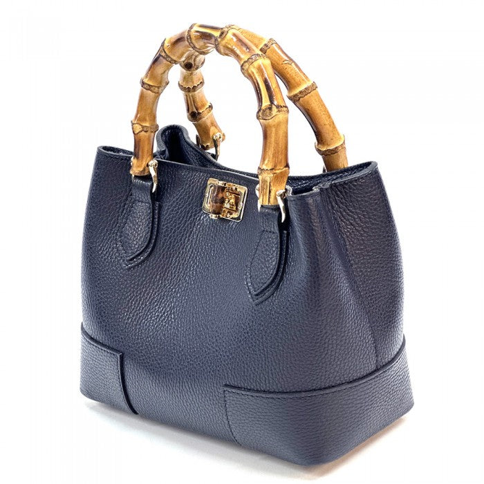 A Blue Fabrizia small leather handbag with bamboo handles and a front pocket detail.
