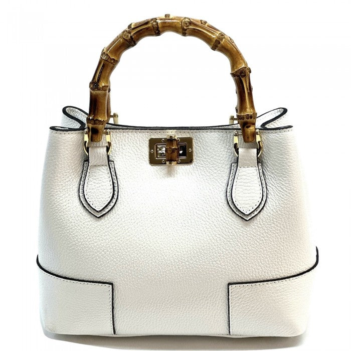 A white Fabrizia small leather handbag with bamboo handles and a front pocket detail.