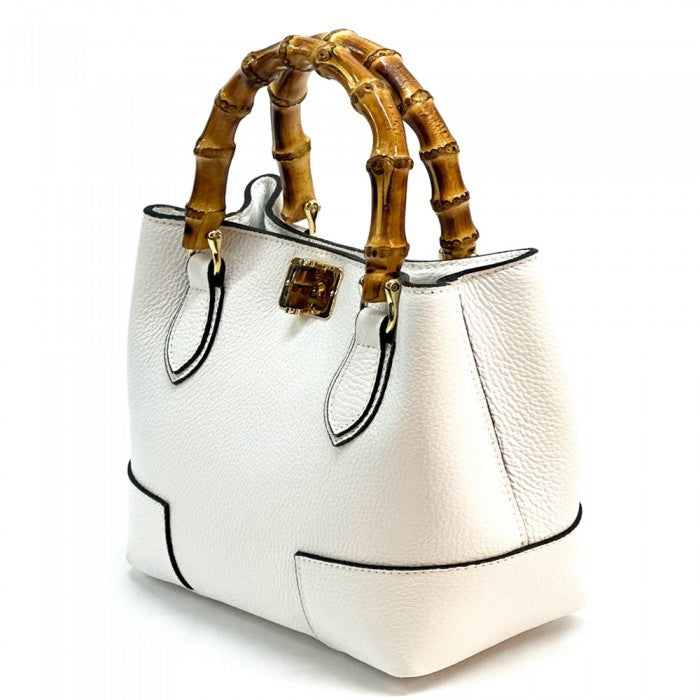 A white Fabrizia small leather handbag with bamboo handles and a front pocket detail.
