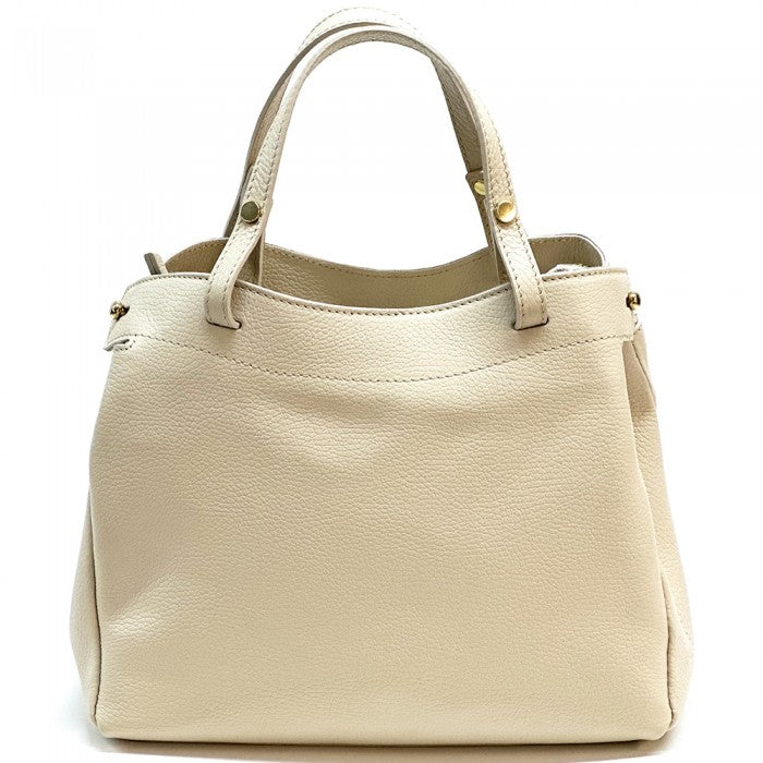 A beige Italian leather handbag with structured silhouette and gold-tone hardware, featuring sturdy handles and a detachable shoulder strap.