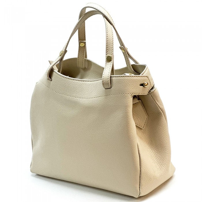 A beige Siena handbag made of premium Italian leather, featuring a structured silhouette with soft curves and gold-tone hardware, designed for both casual and formal settings.