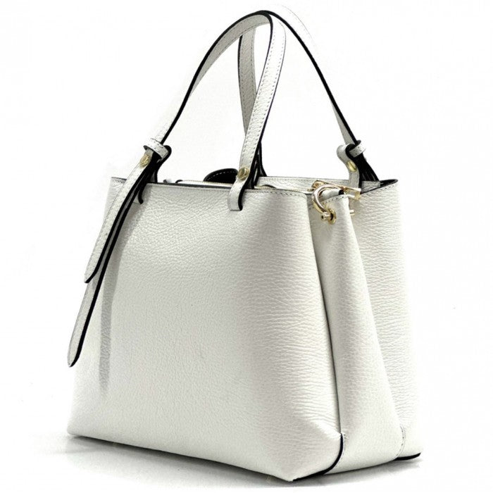 A white Katrine leather handbag with dual handles and a detachable shoulder strap, displayed against a plain background.