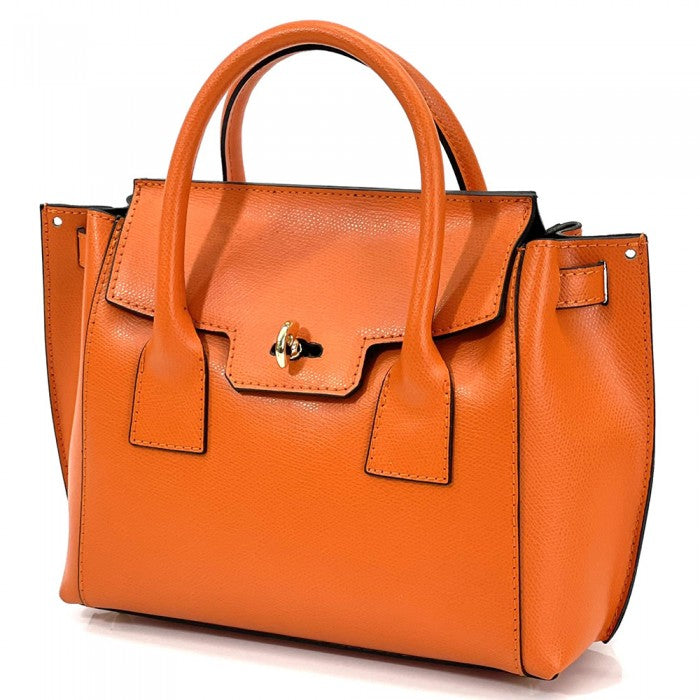 A Italian leather handbag with a structured design, double handles, and a gold-tone clasp.