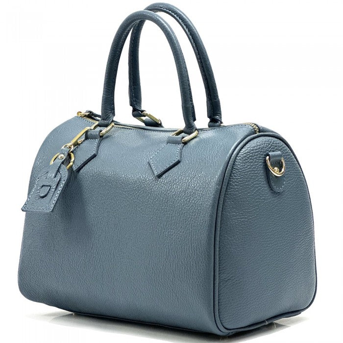A Erminia GM cow leather handbag with visible texture, two handles, and metallic hardware.