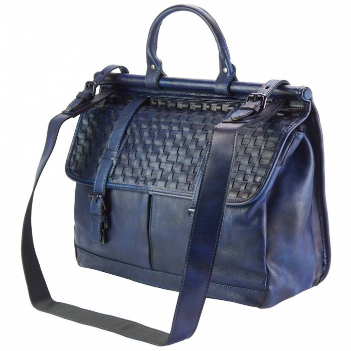 A navy blue leather handbag with a woven pattern on the front, featuring a shoulder strap, a hand carry handle, and a magnetic clasp.