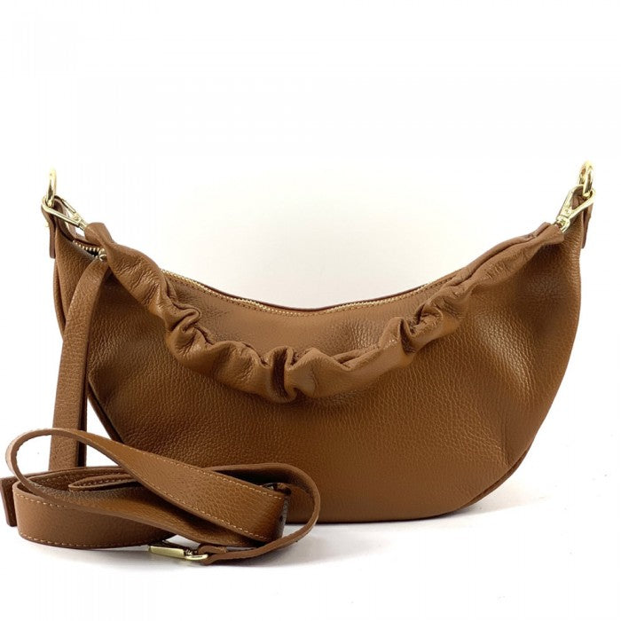 A brown Tara Small Hobo leather handbag with a single handle and adjustable shoulder strap.