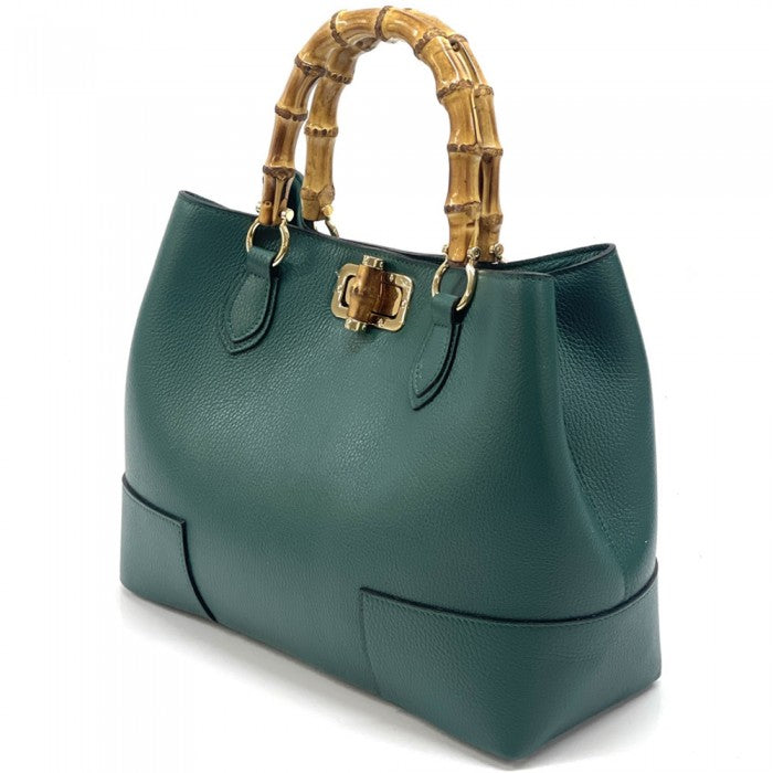 A green Fabrizia leather handbag with bamboo handles and a turn-lock closure.