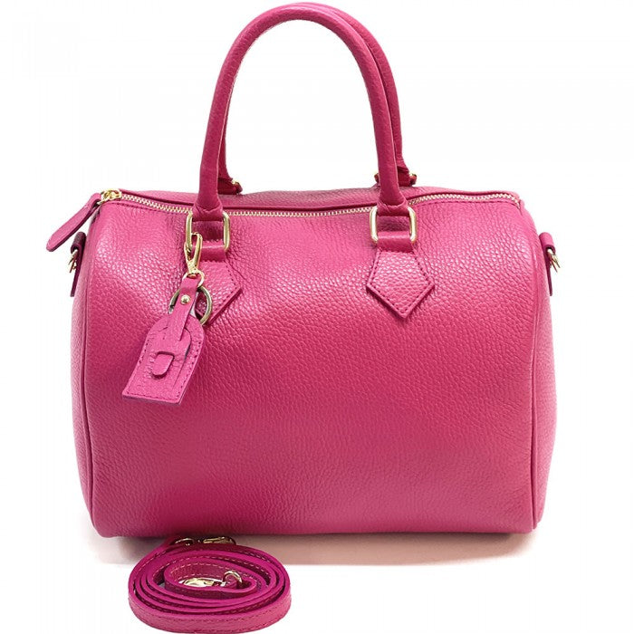 A pink Erminia GM cow leather handbag with visible texture, two handles, and metallic hardware.